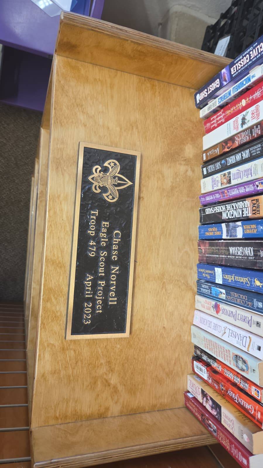 Detail of the plaque mounted on the completed library bookshelf